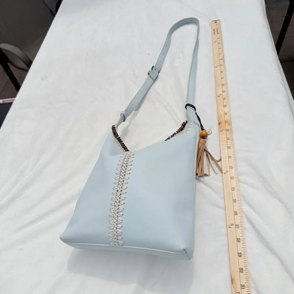The Sak Huntley Chambray Blue Pebbled Leather Hobo Crossbody Bag Tassel Boho